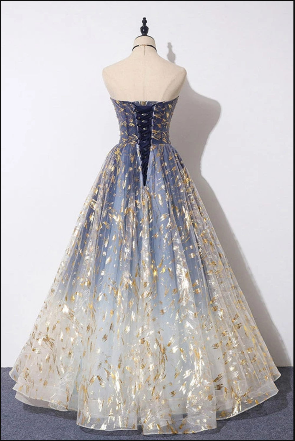 Blue ombre formal dress detail shot of color gradation and tulle fabric layers