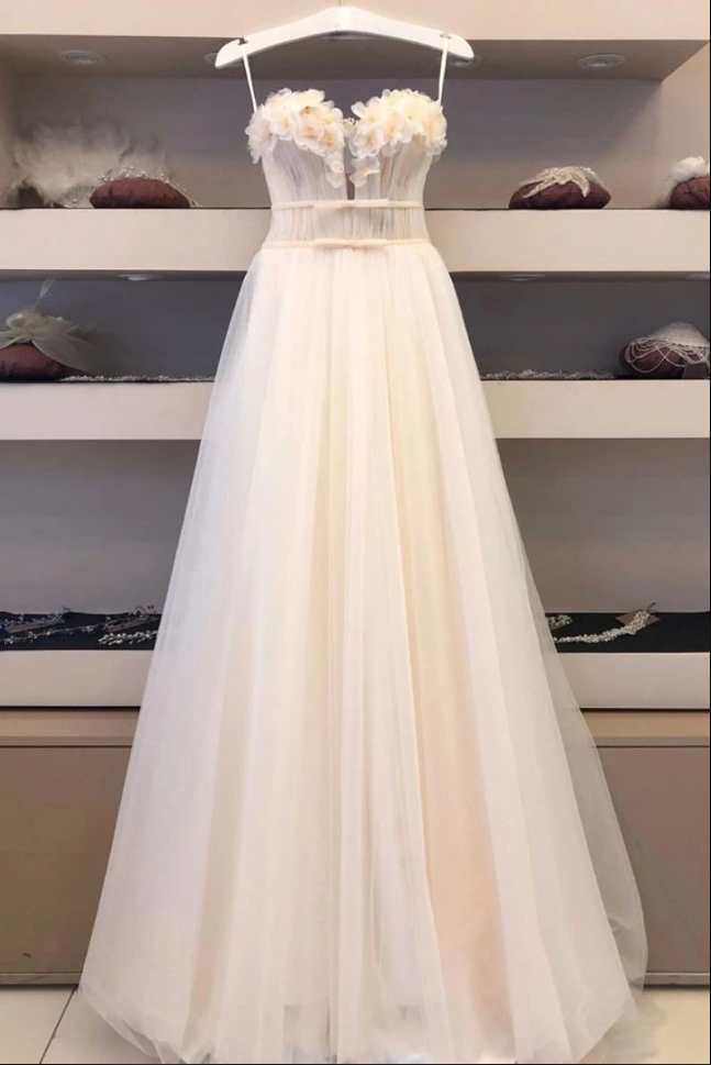 Tulle sweetheart formal gown detail view showing elegant neckline and soft fabric layers