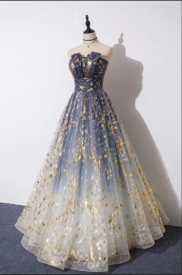 Blue ombre evening gown side view showing stunning color transition and flowing skirt