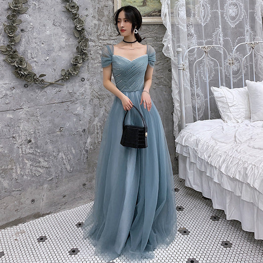 Blue tulle evening gown back view showing elegant design details