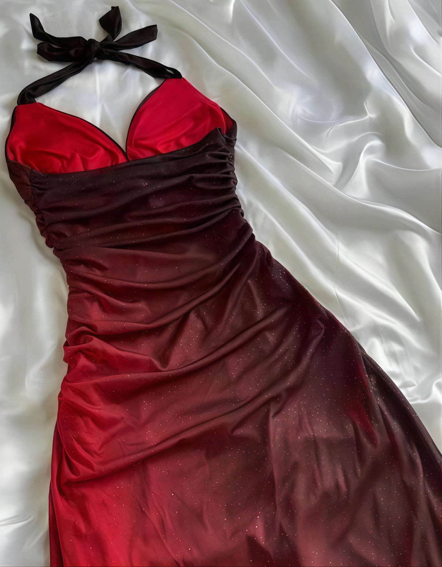 Close-up of burgundy ombre color transition on formal gown