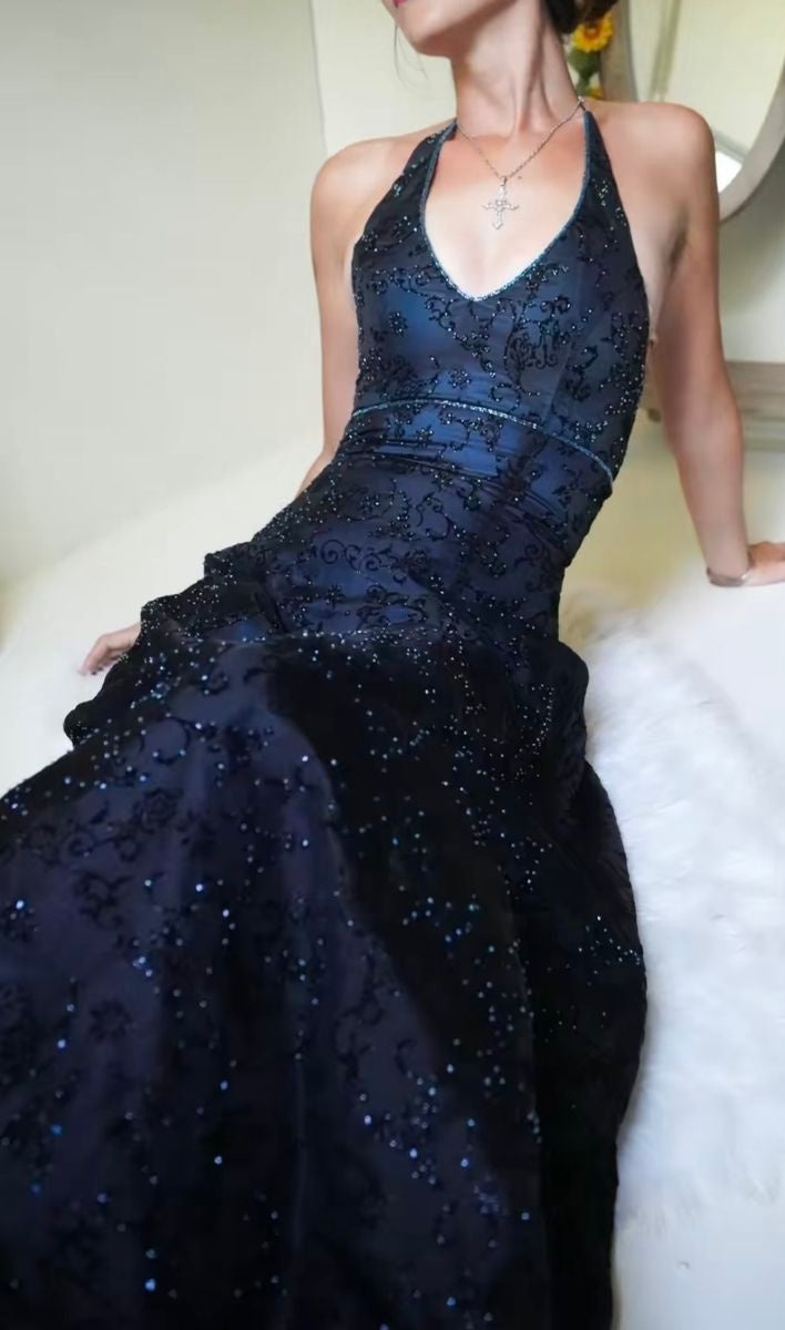 Close-up of purple lace detailing on halter prom dress bodice