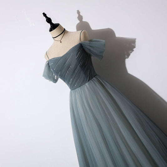 Elegant tulle evening gown back view showing graceful A-line silhouette