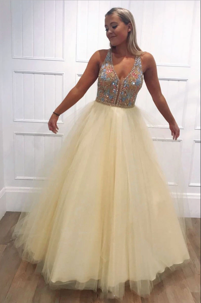 Yellow V-neck beaded tulle prom dress with sparkling embellishments and elegant long silhouette